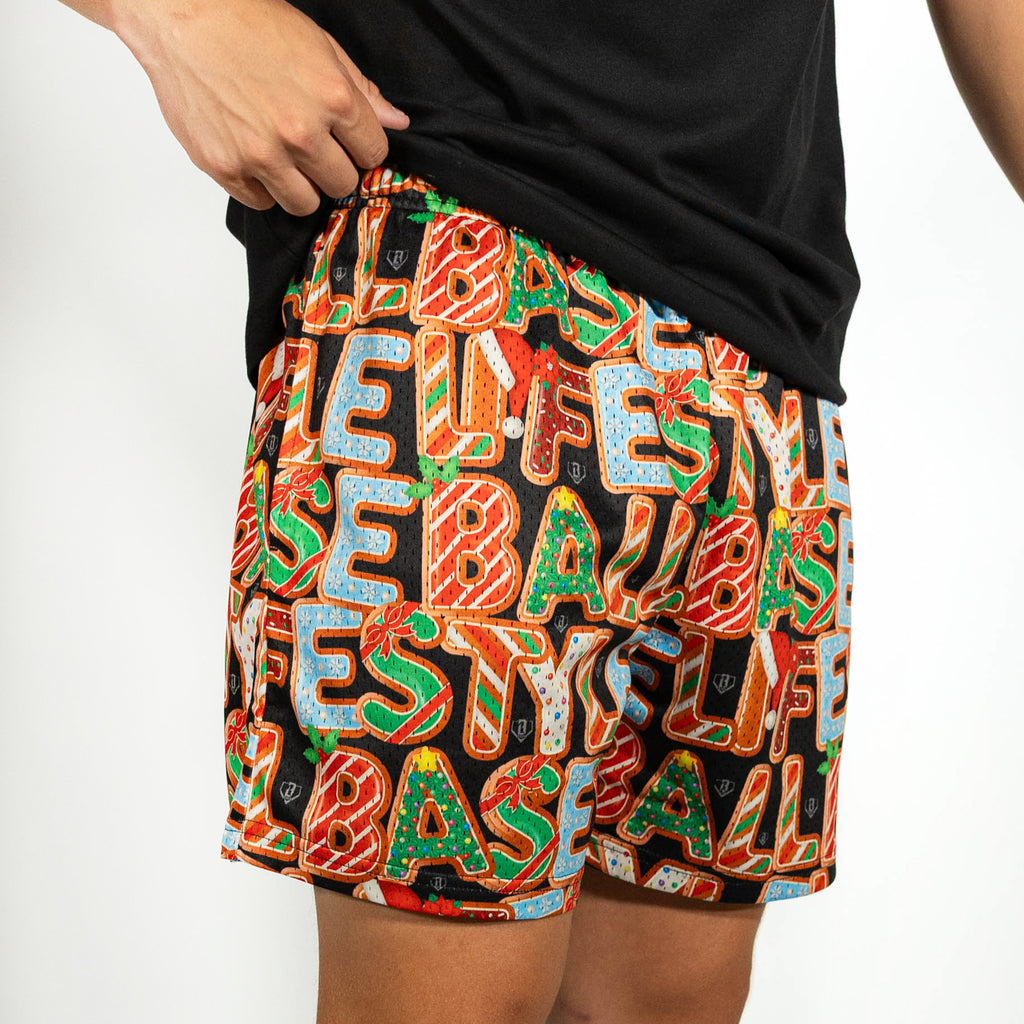 Adult model wearing multi-color shorts with "Holiday Cookie" design