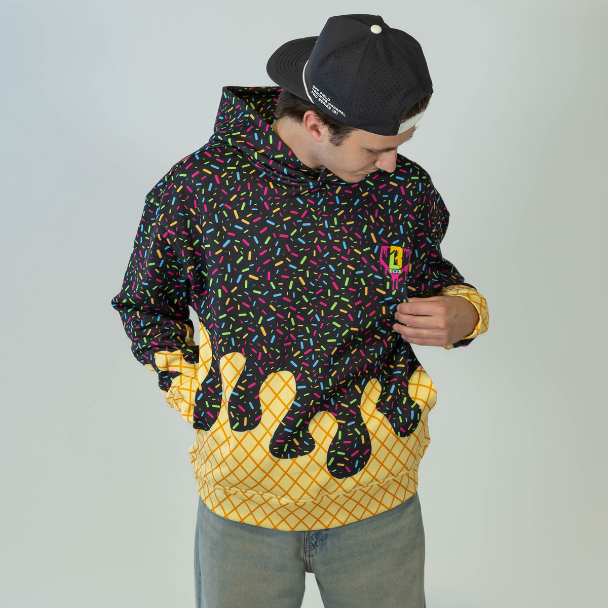 Adult model wearing black Ice Cream Midnight Sundae hoodie with "Ice Cream" design