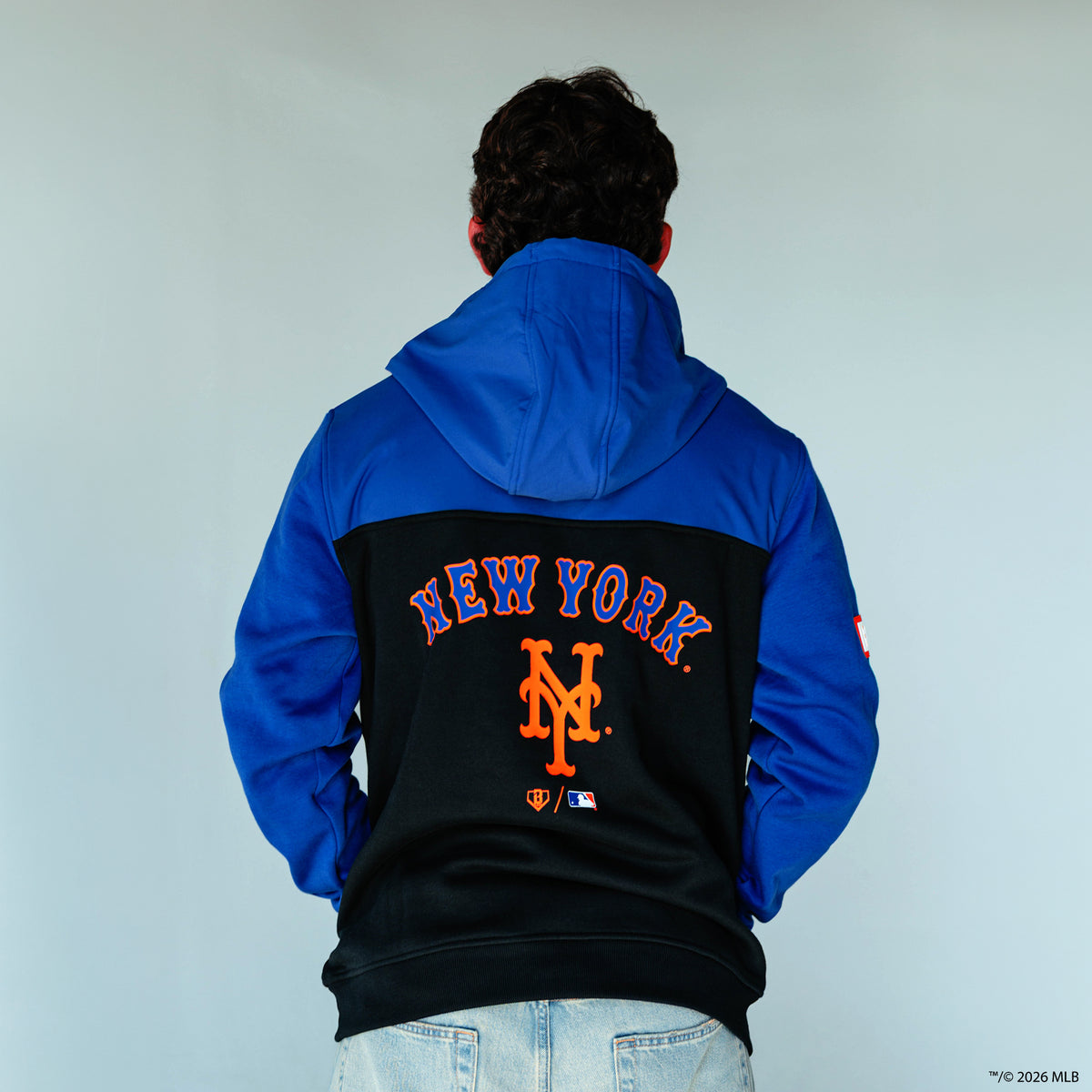 Adult model wearing blue New York Mets Color Block quarter zip