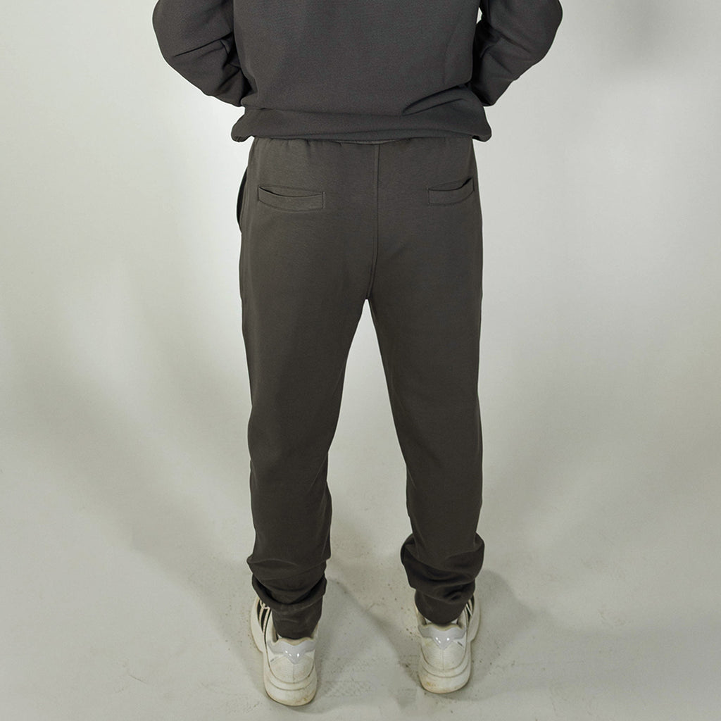 Adult model wearing gray and lilac Diamond Relaxed Fit joggers