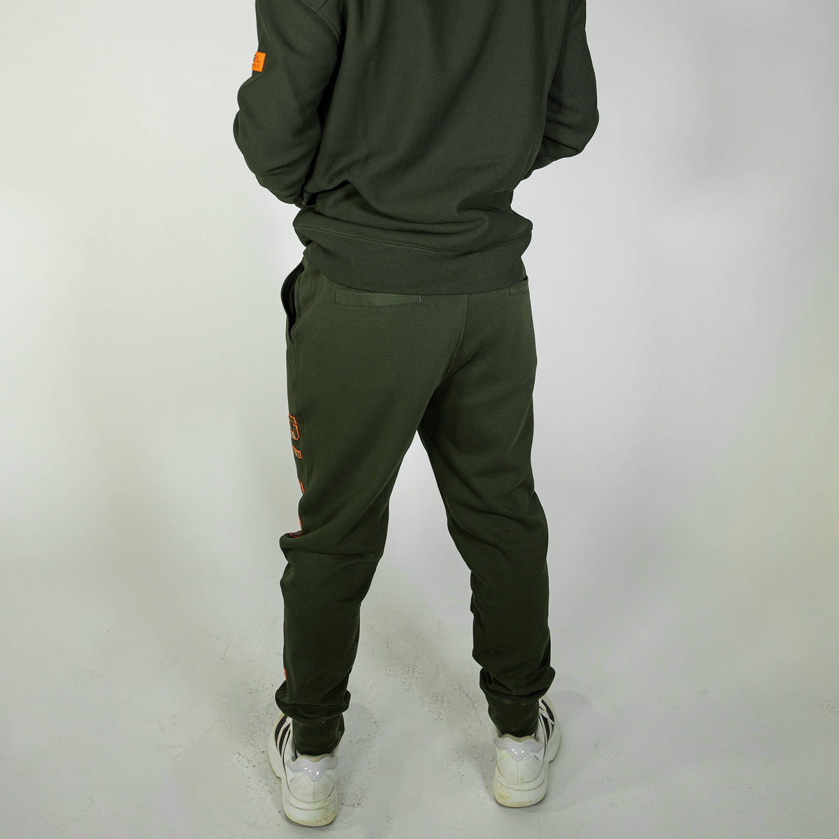 Adult model wearing green Realtree Legacy Diamond Relaxed Fit Camo joggers