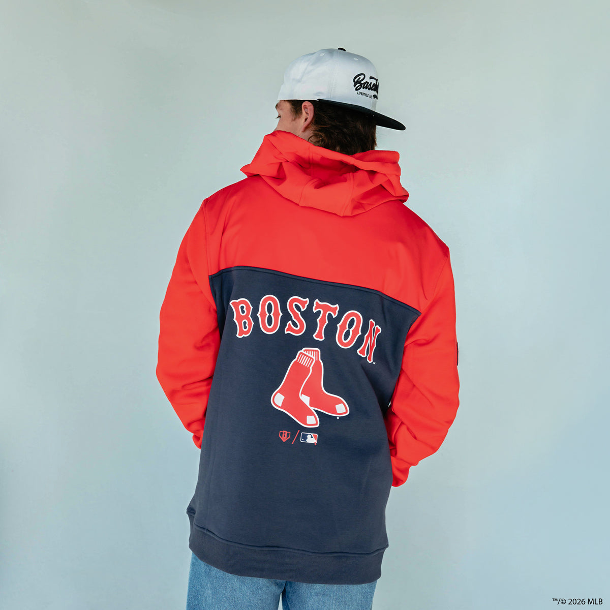 Adult model wearing red Boston Red Sox Color Block quarter zip