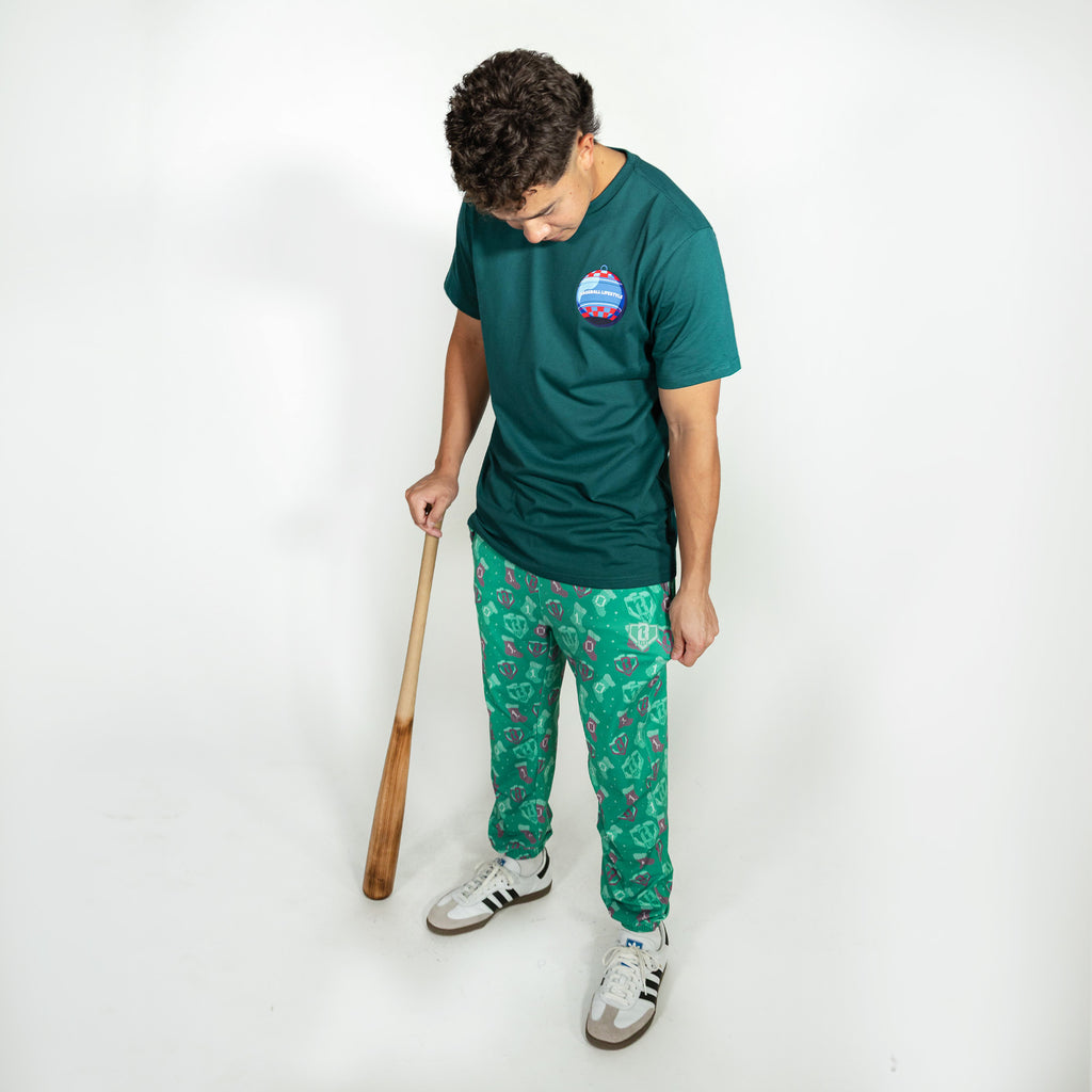 Adult model wearing green Stitched For The SZN pajama pants
