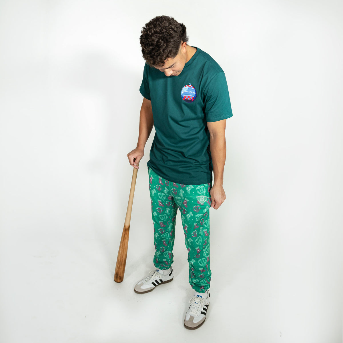 Adult model wearing green Stitched For The SZN pajama pants