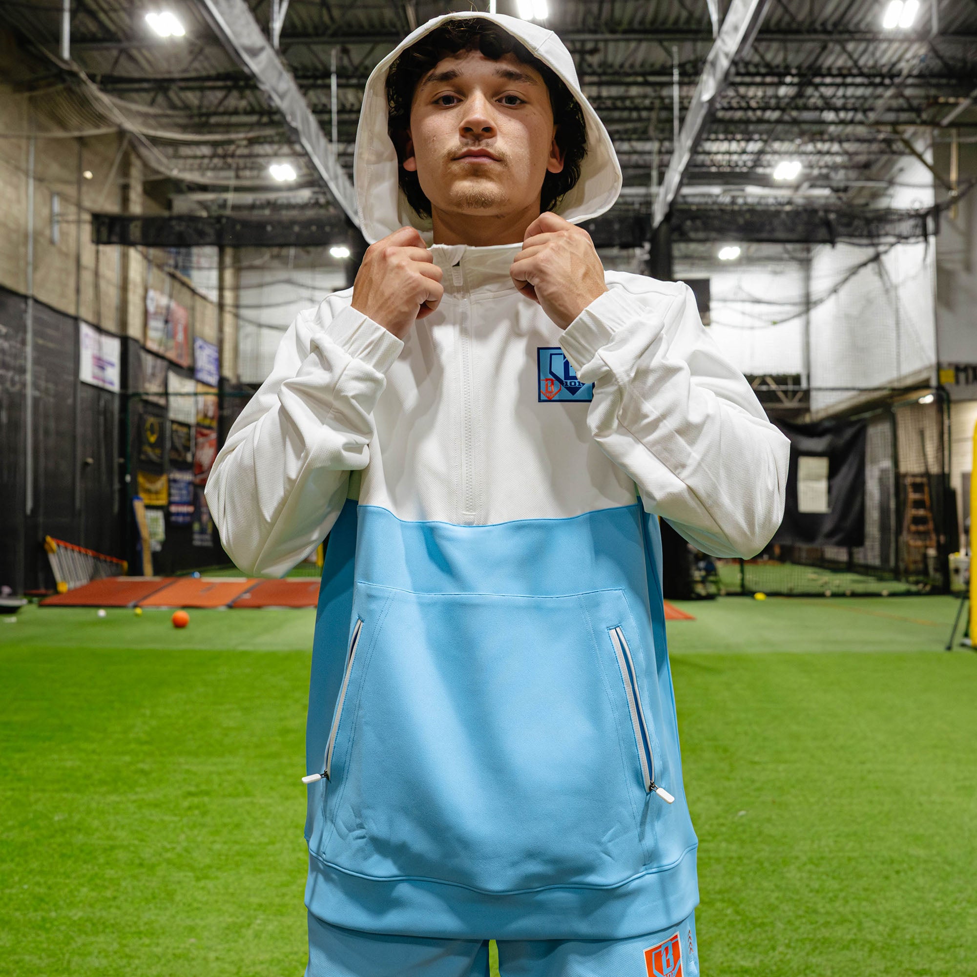 Adult model wearing multi-color hoodie with "UVChangeup Trash Talk" design
