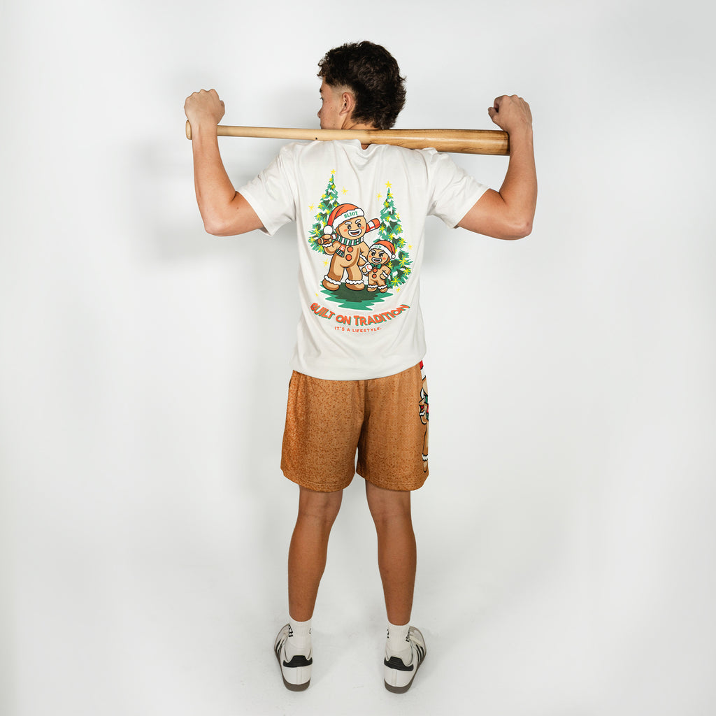 Adult model wearing brown shorts with "Gingerbread Rookie" design