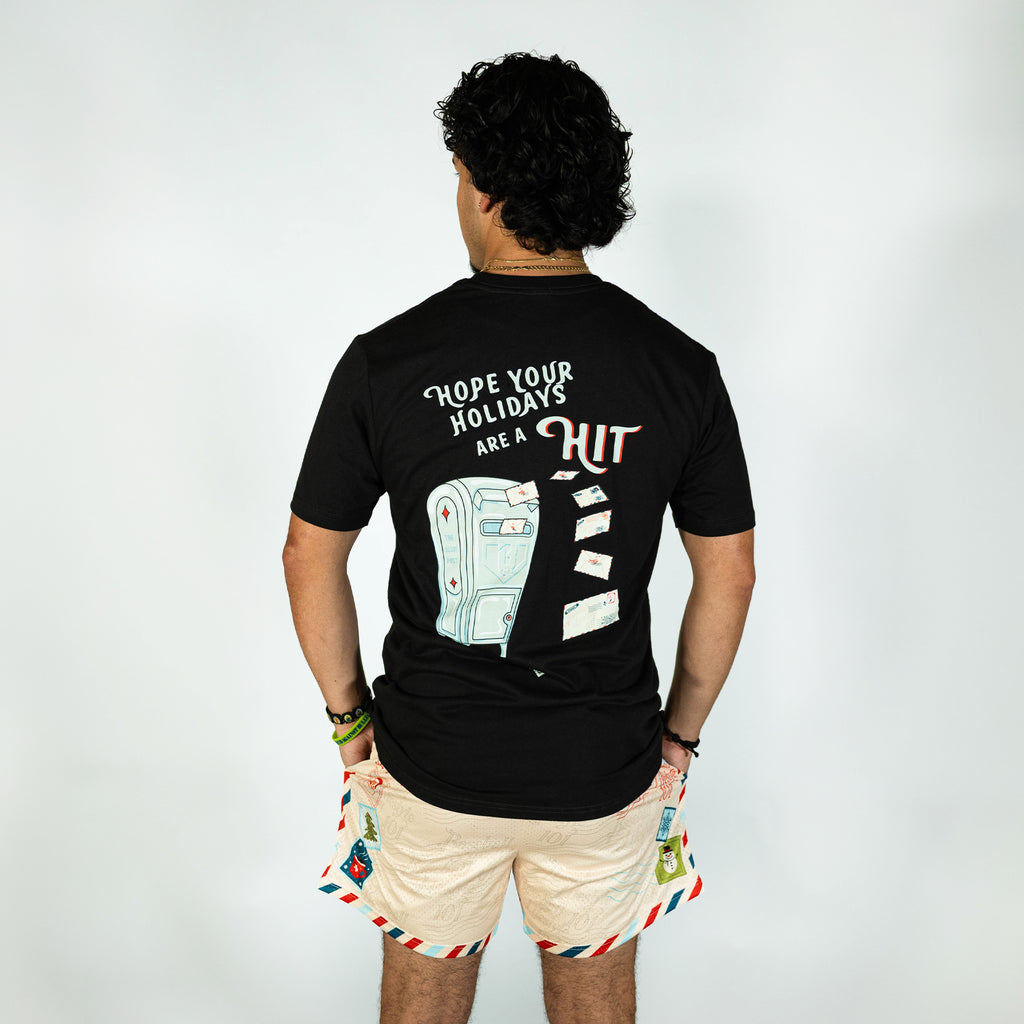 Adult model wearing white shorts with "Letter To Santa" design