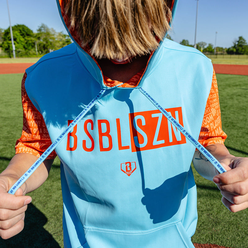 Adult model wearing blue short sleeve hoodie with "BSBL-SZN V3" design