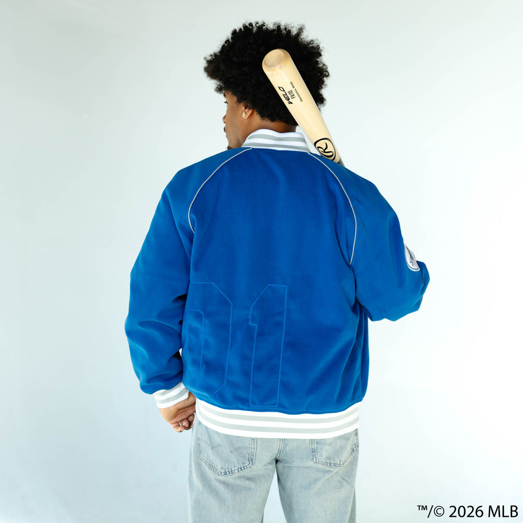 Adult model wearing blue Los Angeles Dodgers Stadium bomber jacket