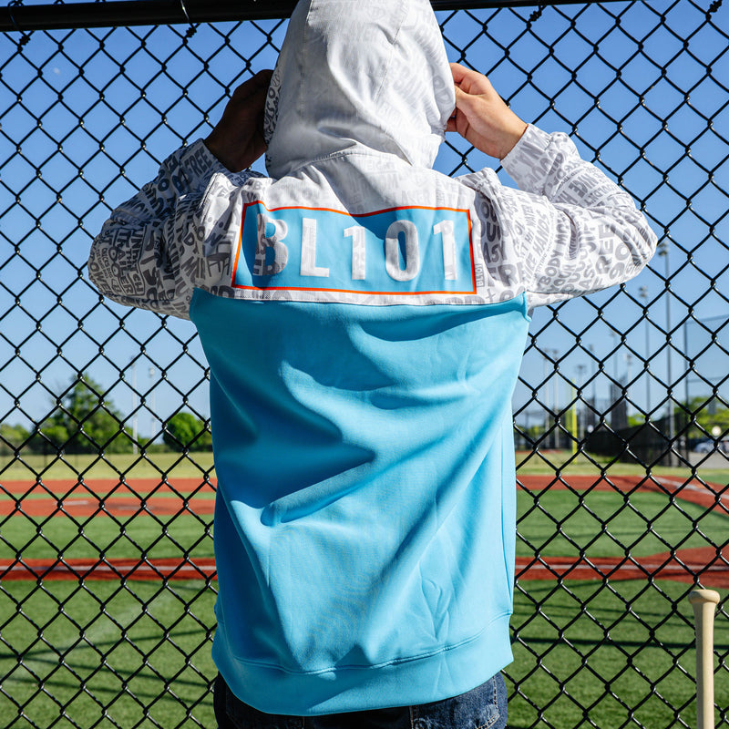 Adult model wearing multi-color hoodie with "UVChangeup Trash Talk" design