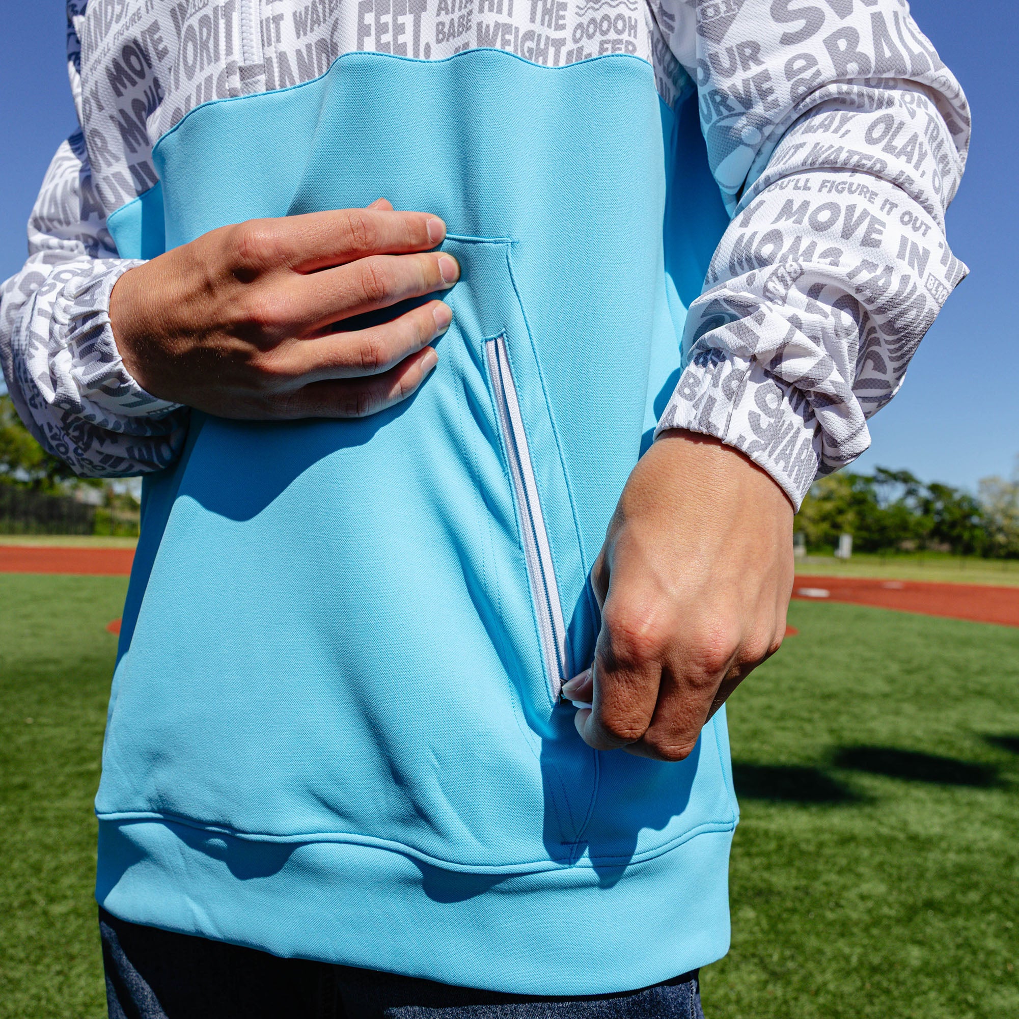 Adult model wearing multi-color hoodie with "UVChangeup Trash Talk" design