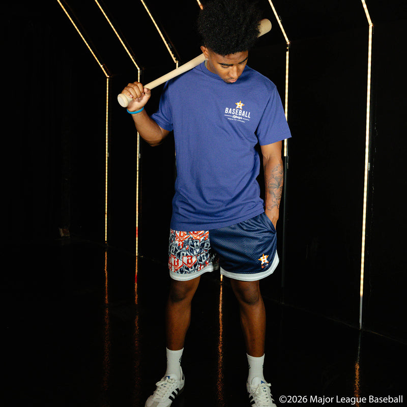 Adult model wearing blue shorts with "Houston Astros Sticker Court" design