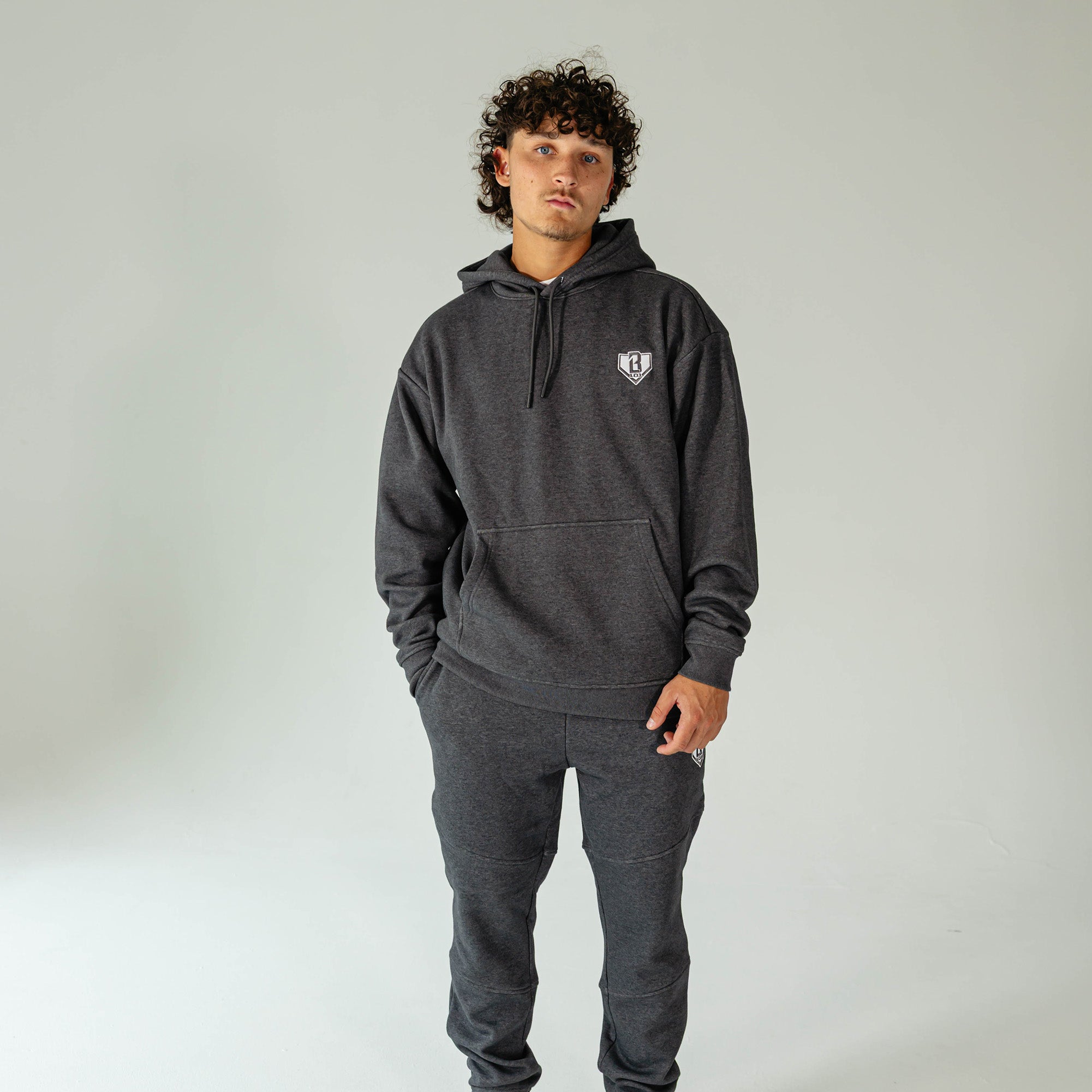Adult model wearing Gray Baseline hoodie
