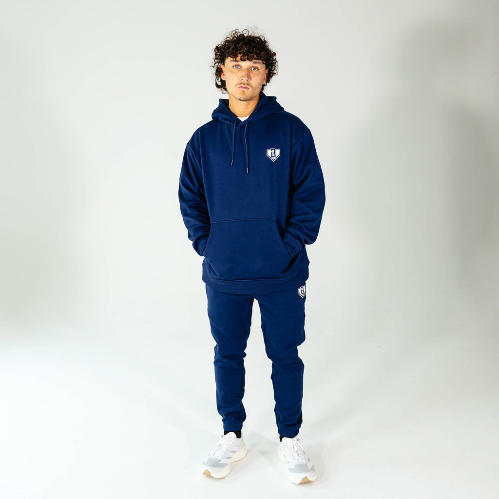 Adult model wearing Navy Baseline hoodie