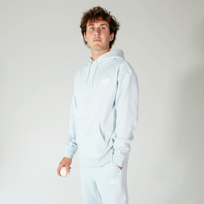 Adult model wearing Blue Baseline hoodie