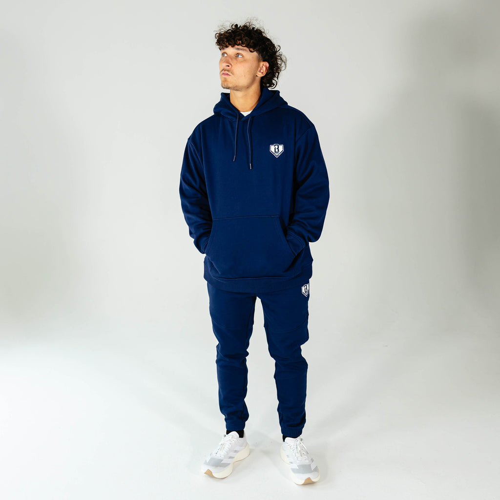 Adult model wearing Navy Baseline joggers