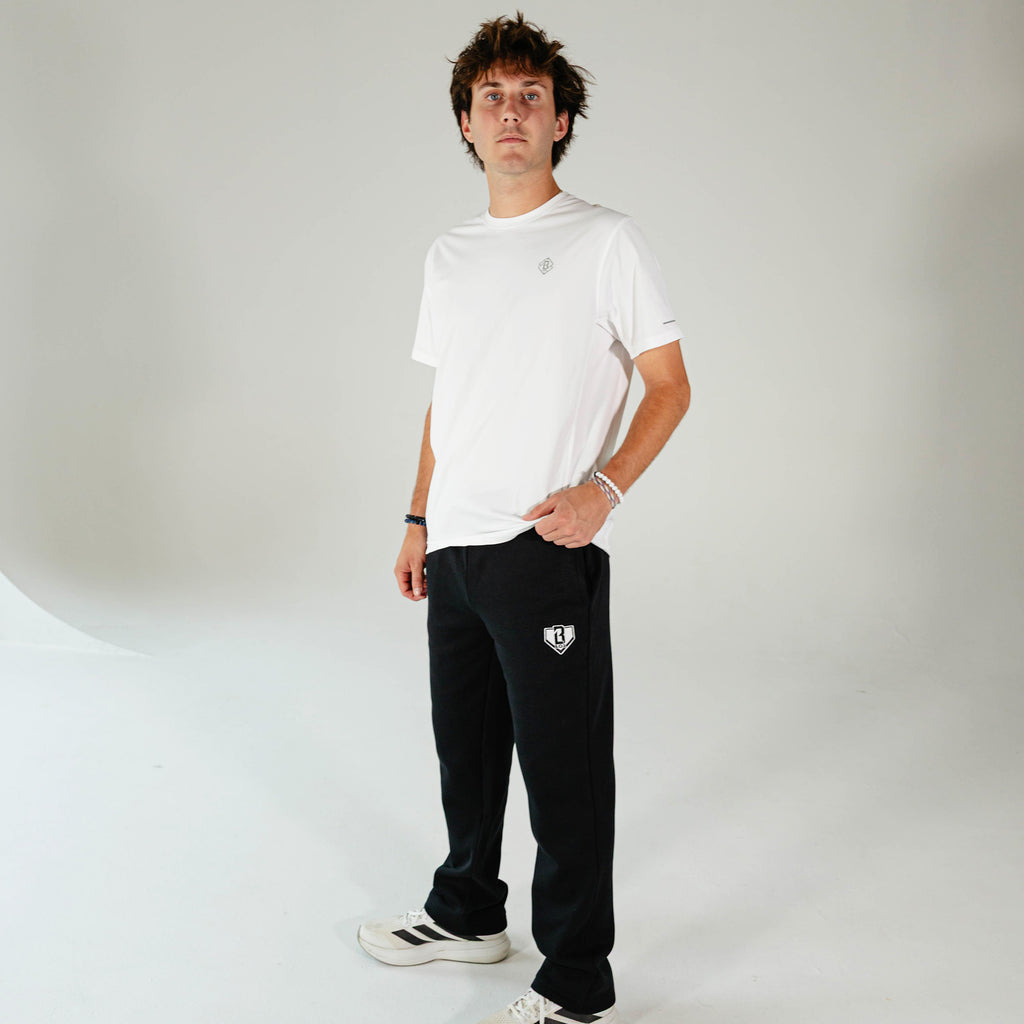 Adult model wearing Black Baseline Straight Leg sweatpants