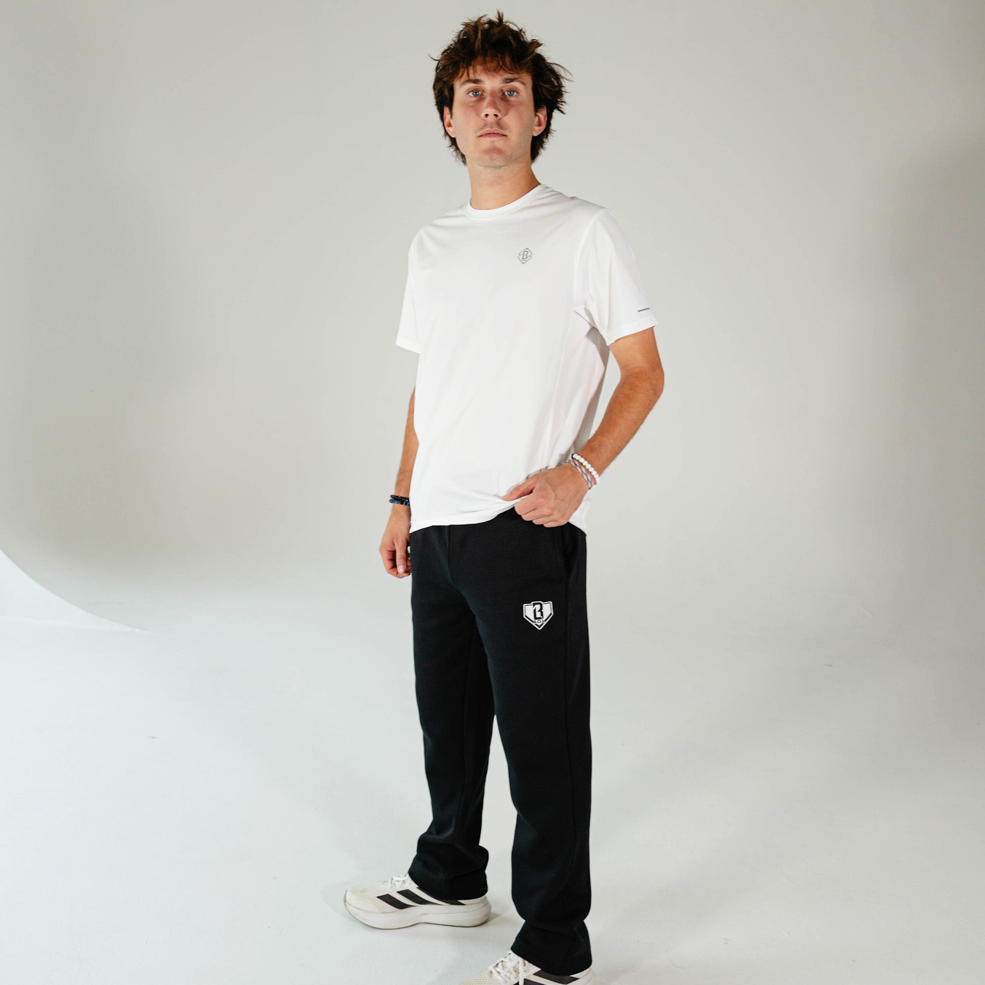 Adult model wearing Black Baseline Straight Leg sweatpants