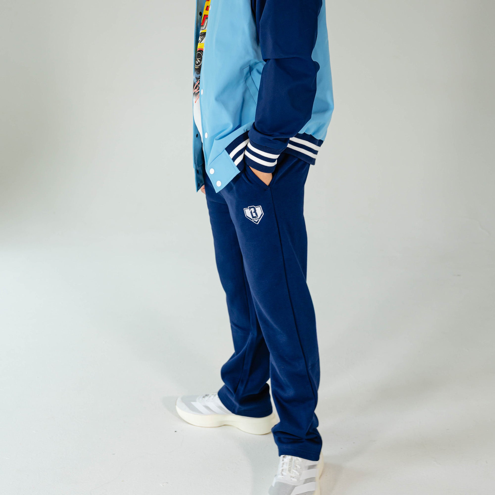Adult model wearing Navy Baseline Straight Leg sweatpants