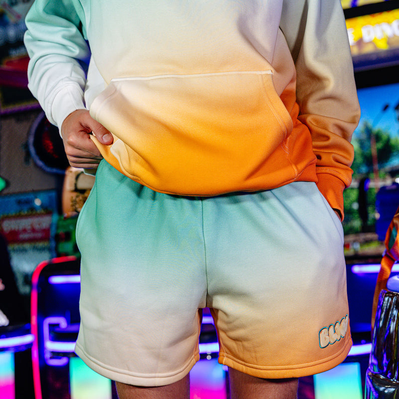 Adult model wearing Cotton Candy Tangerine Freeze shorts