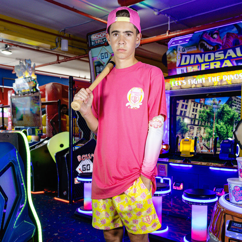 Adult model wearing Home Run Sugar Pink Lemonade shorts
