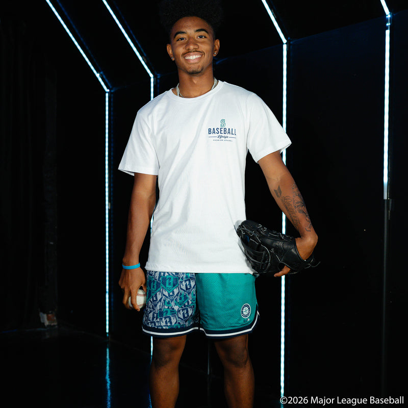 Adult model wearing green shorts with "Seattle Mariners Sticker Court" design