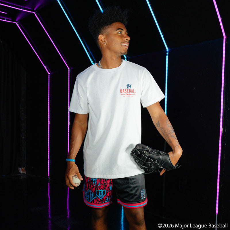 Adult model wearing black shorts with "Miami Marlins Sticker Court" design