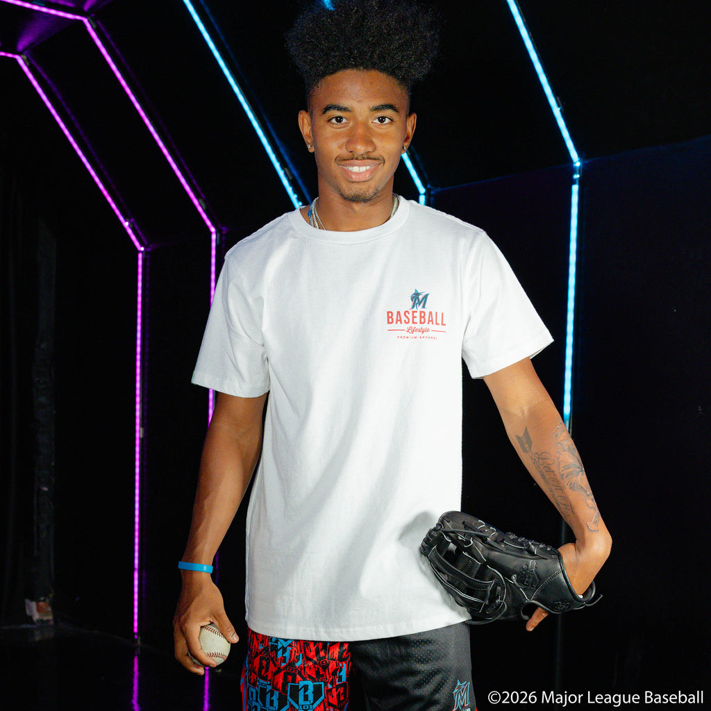 Adult model wearing white graphic tee with "Miami Marlins Ice Cream Cap" design