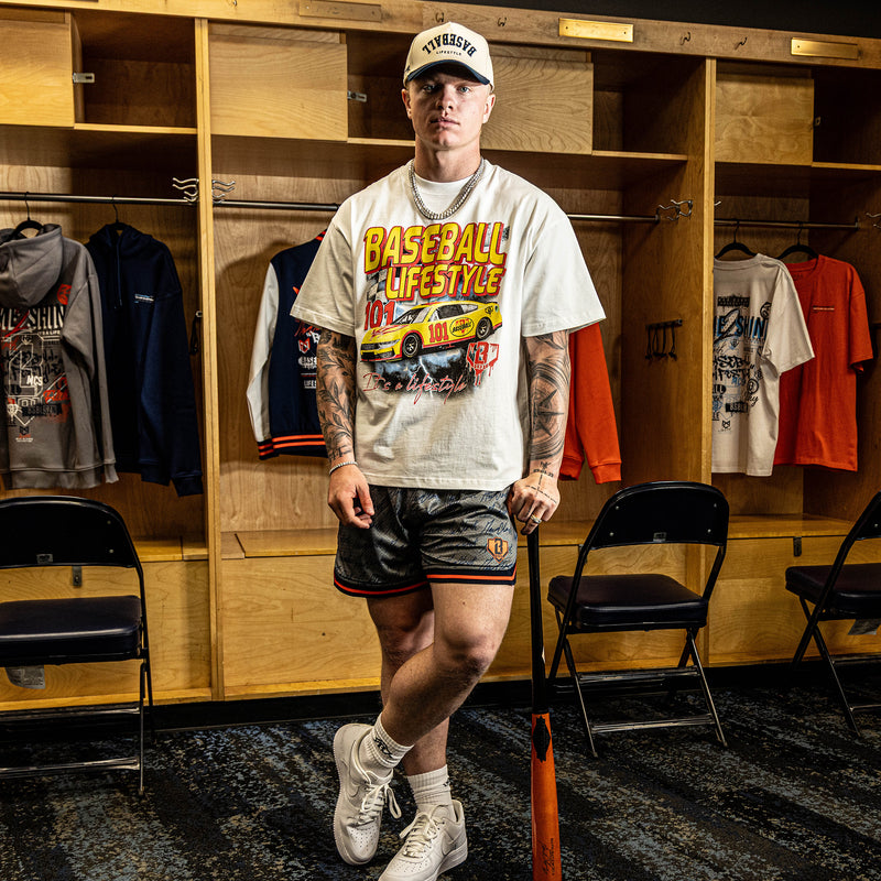 Person wearing a 'Baseball Lifestyle' t-shirt in a locker room.