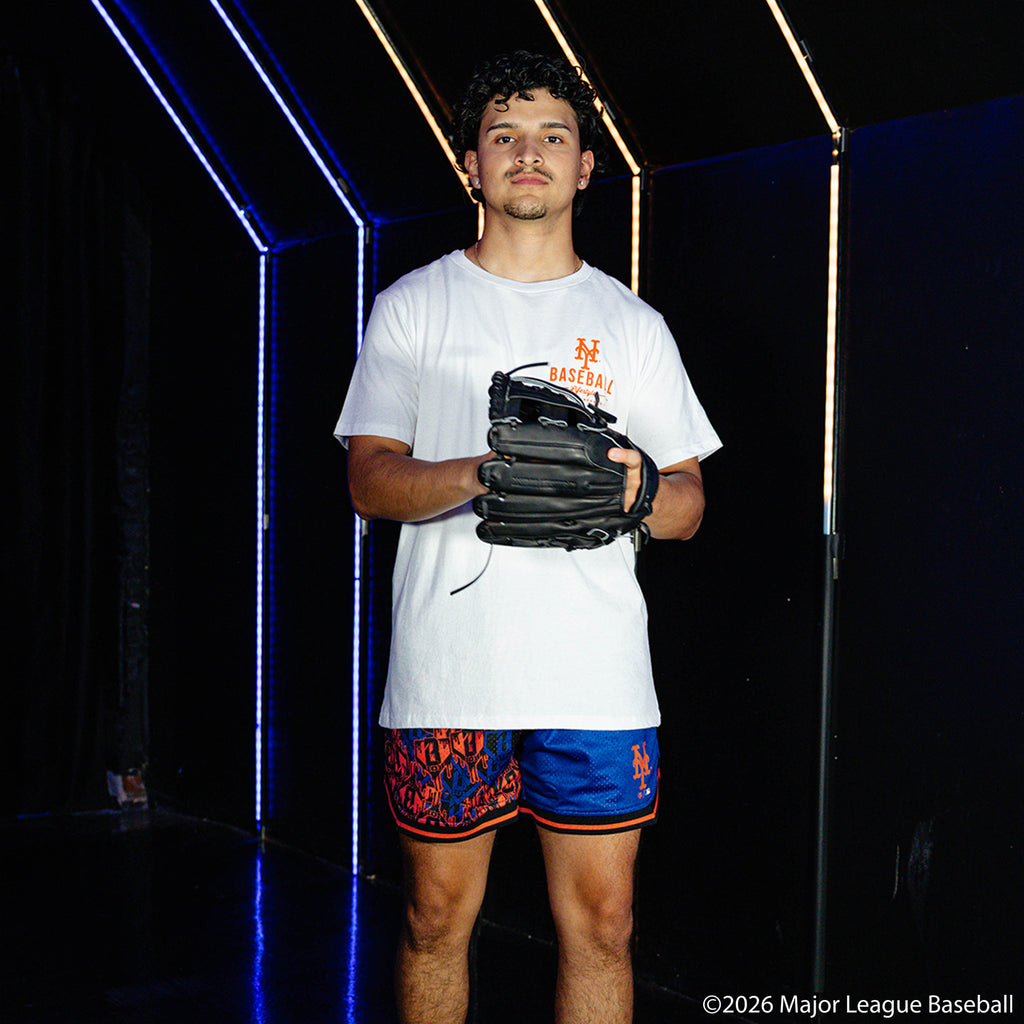 Adult model wearing blue shorts with "New York Mets Sticker Court" design