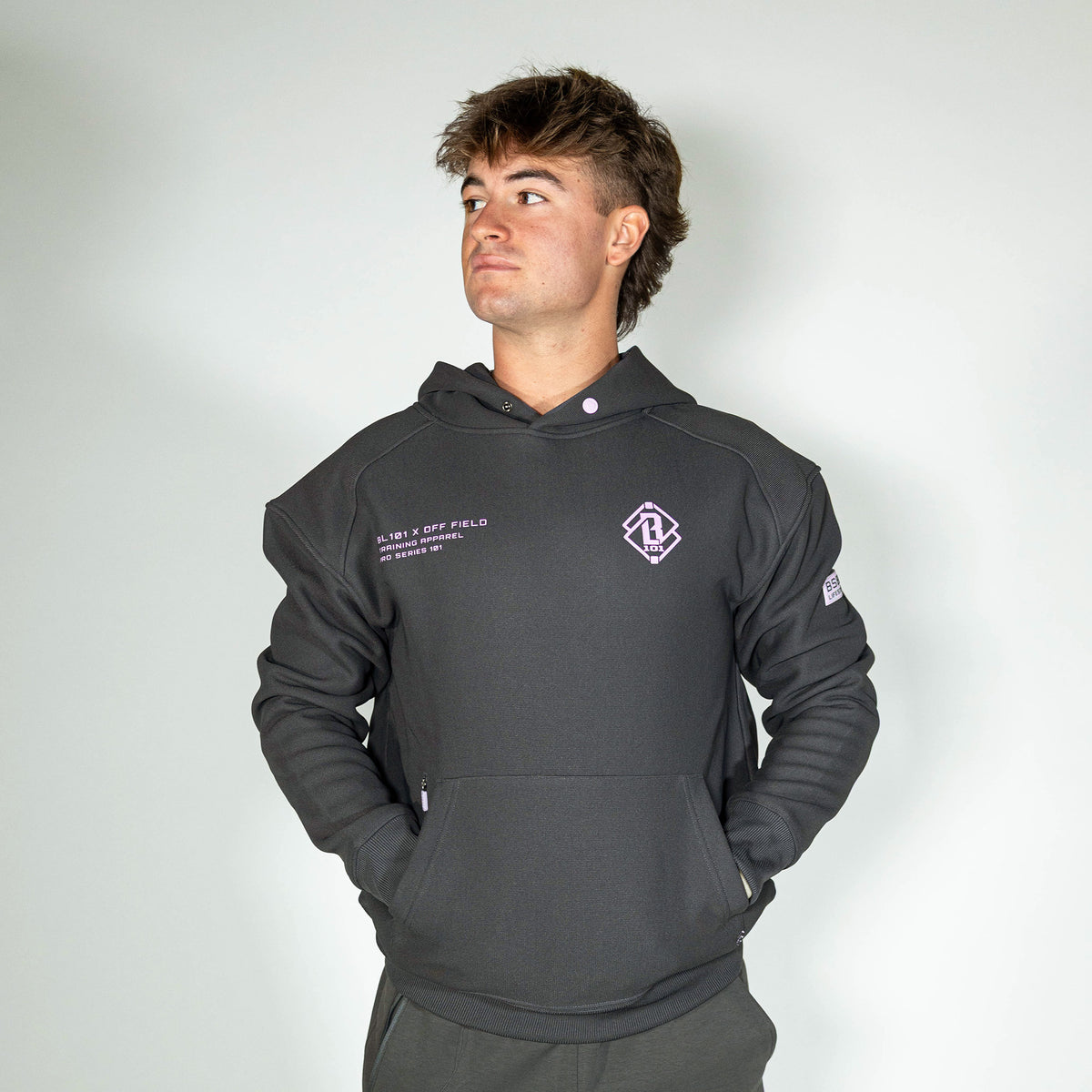 Adult model wearing gray and lilac Off-Field Waffle Performance hoodie