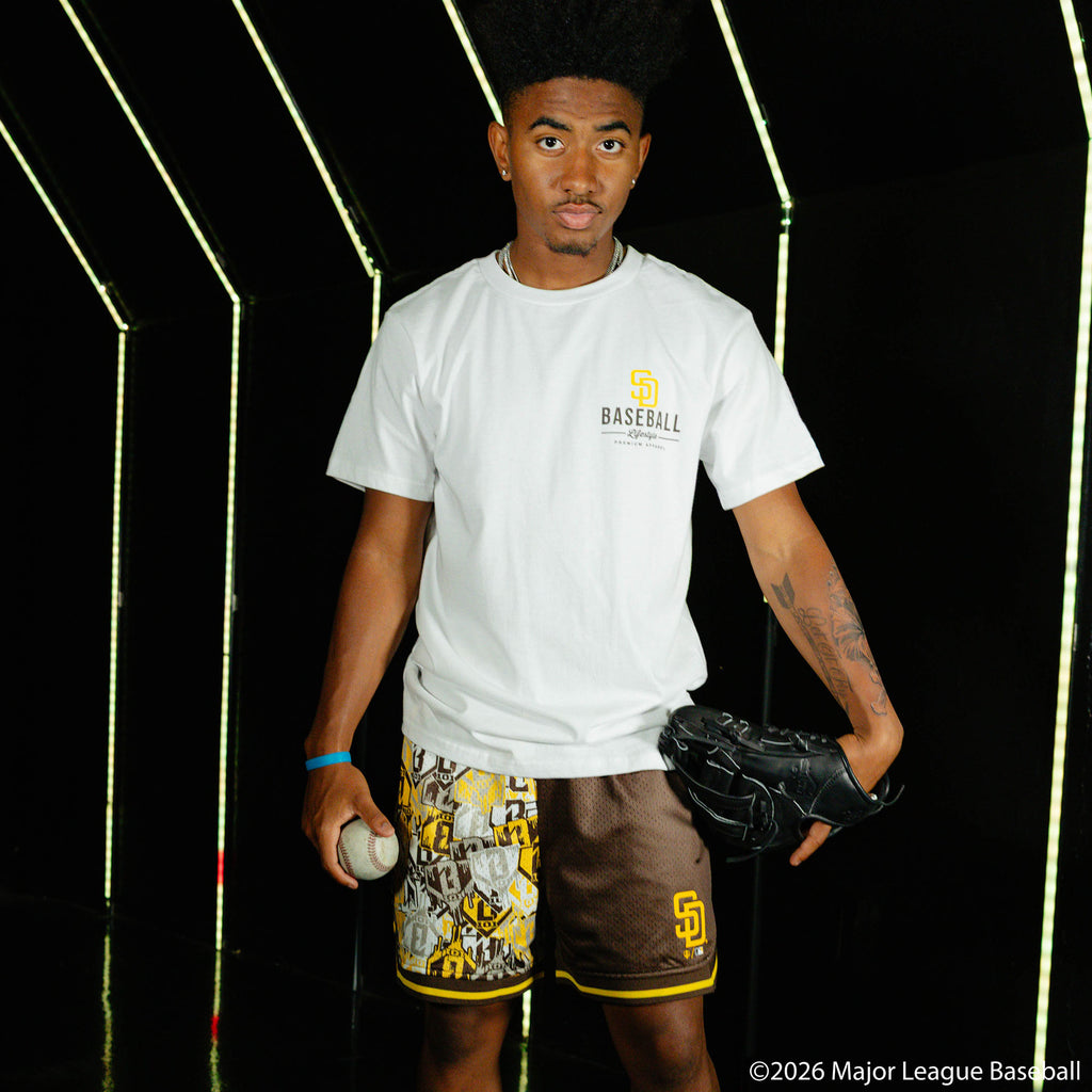 Adult model wearing shorts with "San Diego Padres Sticker Court" design