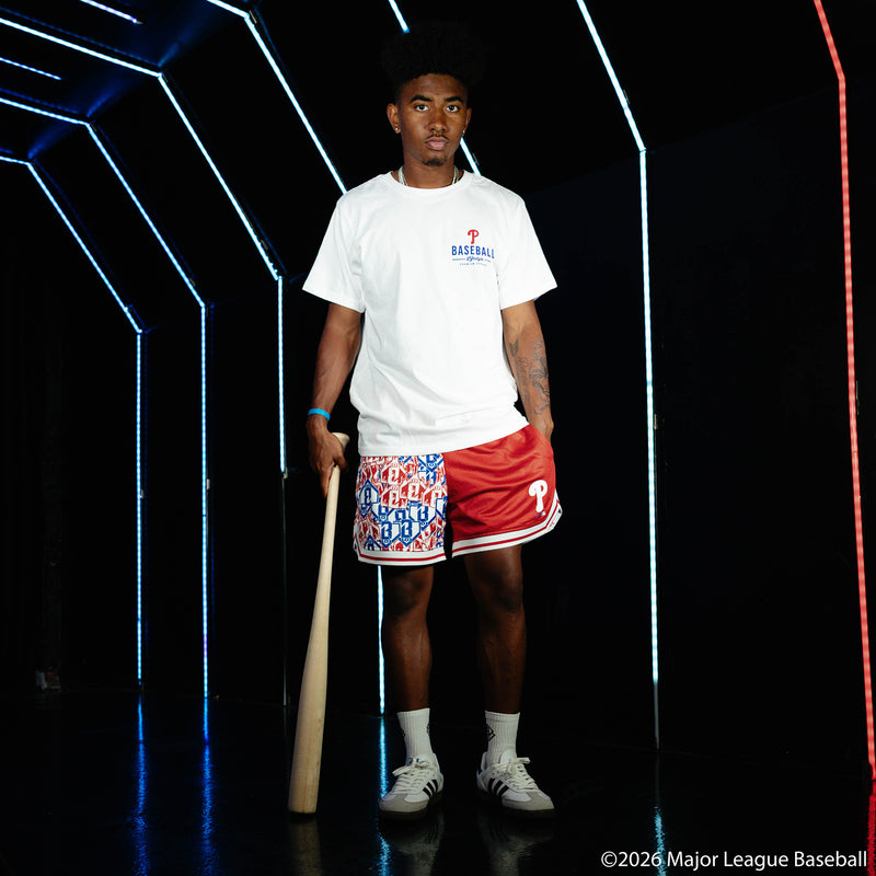 Adult model wearing red shorts with "Philadelphia Phillies Sticker Court" design