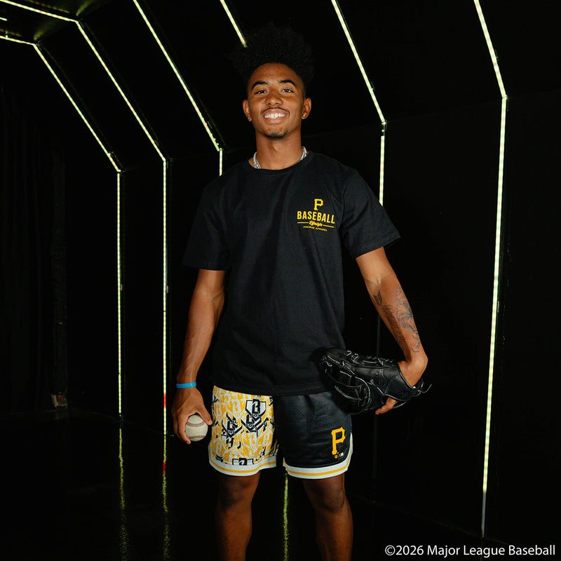 Adult model wearing black shorts with "Pittsburgh Pirates Sticker Court" design