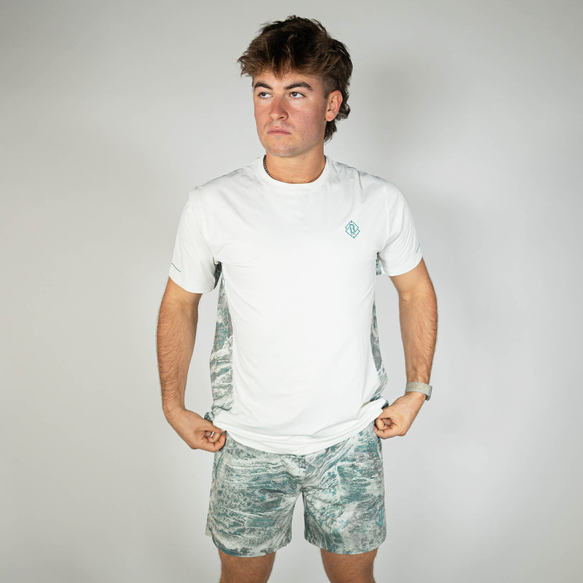 Adult model wearing gray Realtree Aspect Pro Series V2 Camo shorts with liner