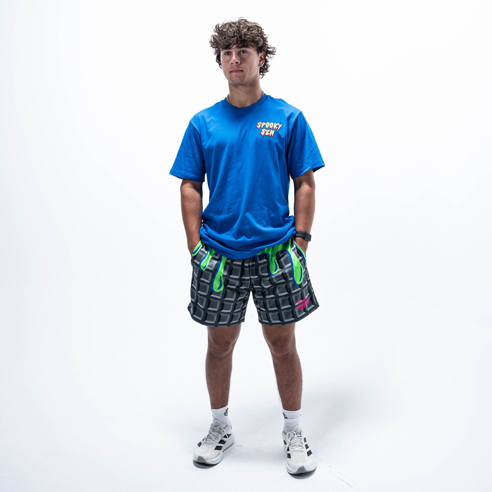 Adult model wearing blue graphic tee with "Spooky SZN Waffle" design