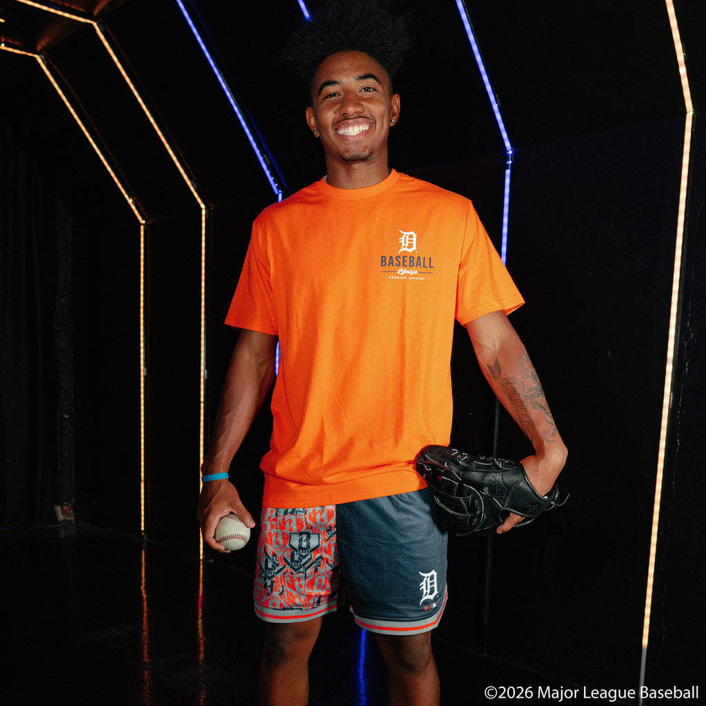 Adult model wearing orange graphic tee with "Detroit Tigers Ice Cream Cap" design