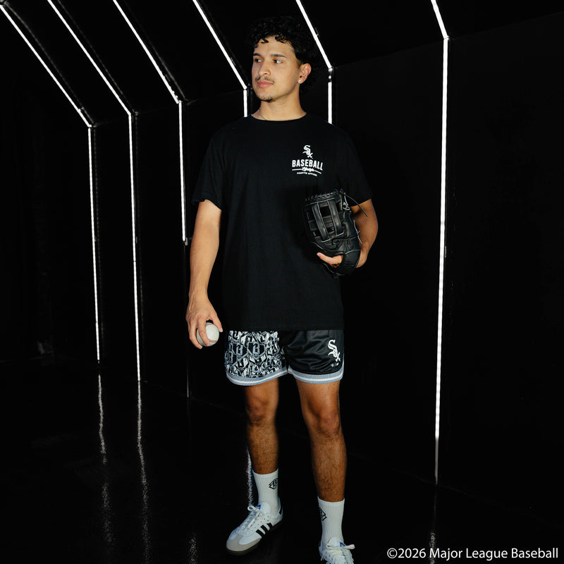 Adult model wearing black shorts with "Chicago White Sox Sticker Court" design