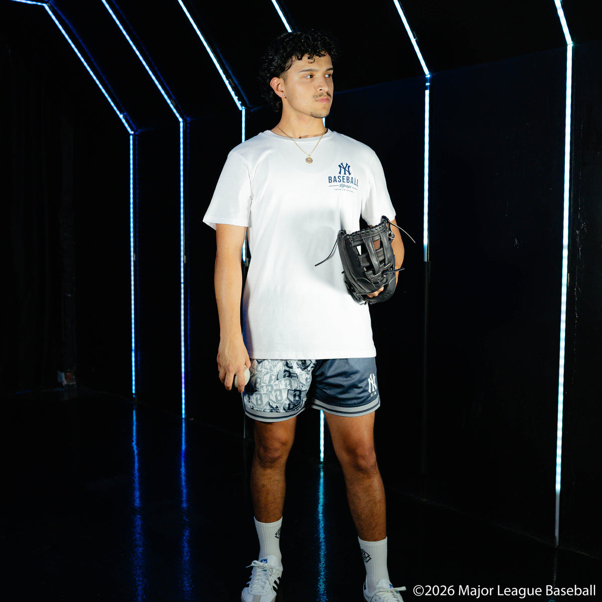 Adult model wearing white graphic tee with "New York Yankees Ice Cream" design