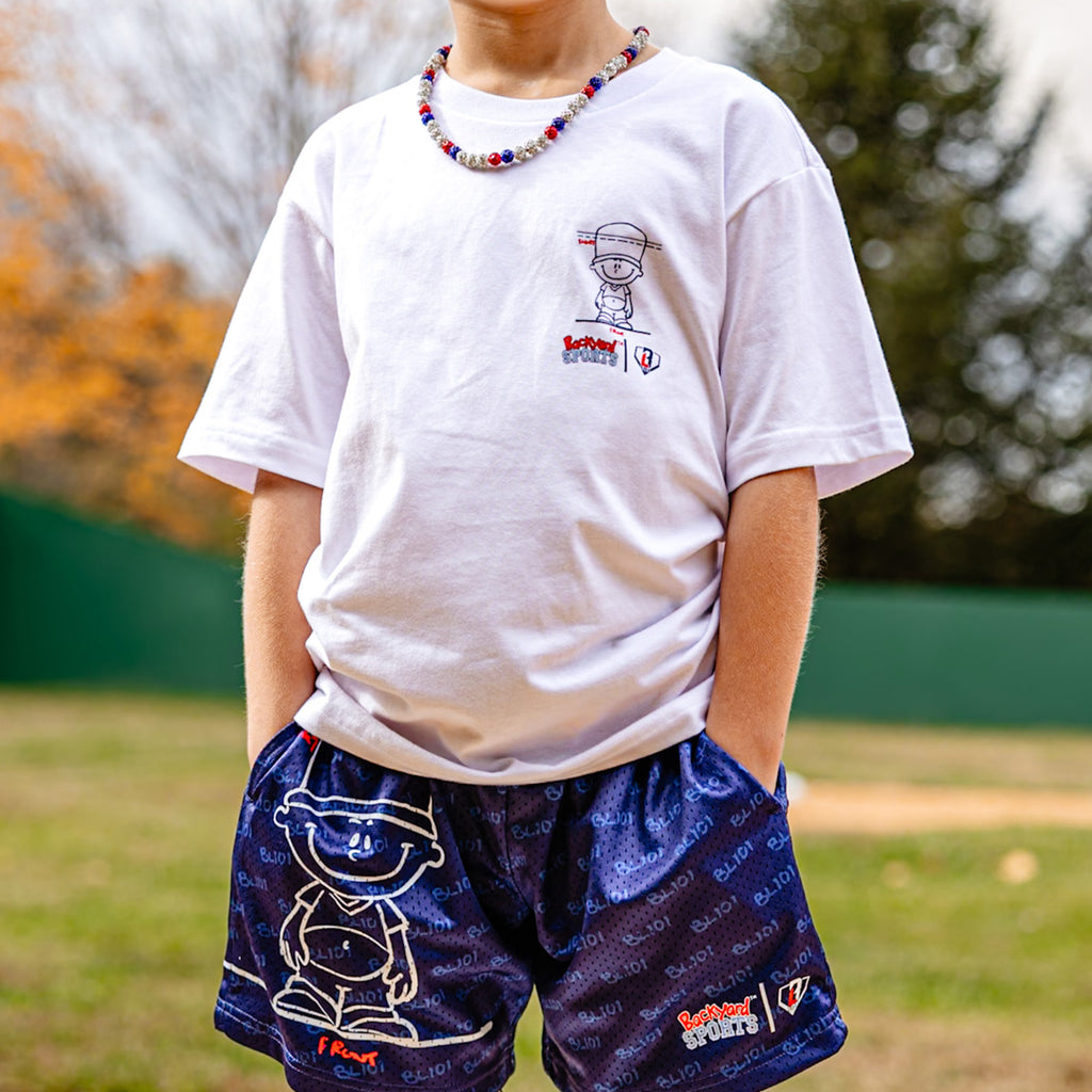 Person wearing a white t-shirt with Pablo Sanchez cartoon and blue shorts Pablo Sanchez shorts 