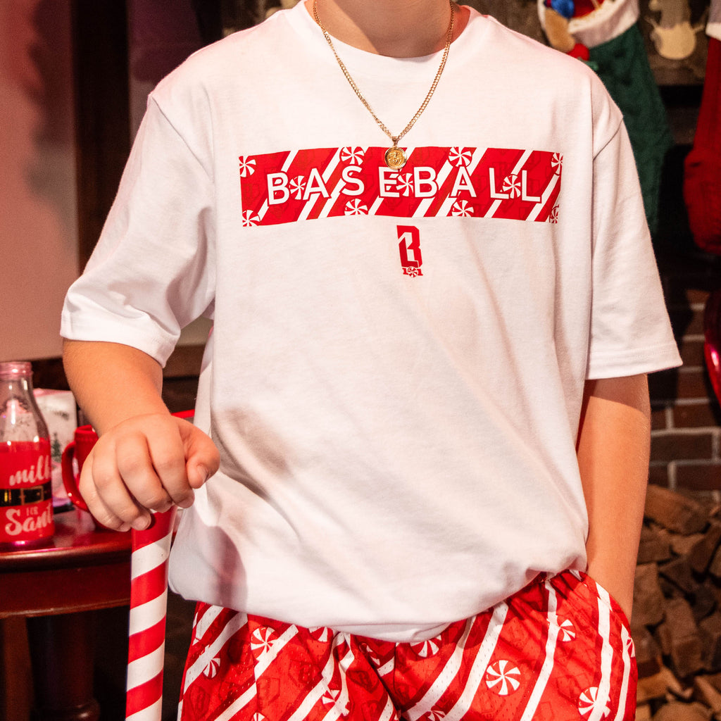 close up of person wearing white t-shirt with red and white candy cane 'Baseball' graphic design 