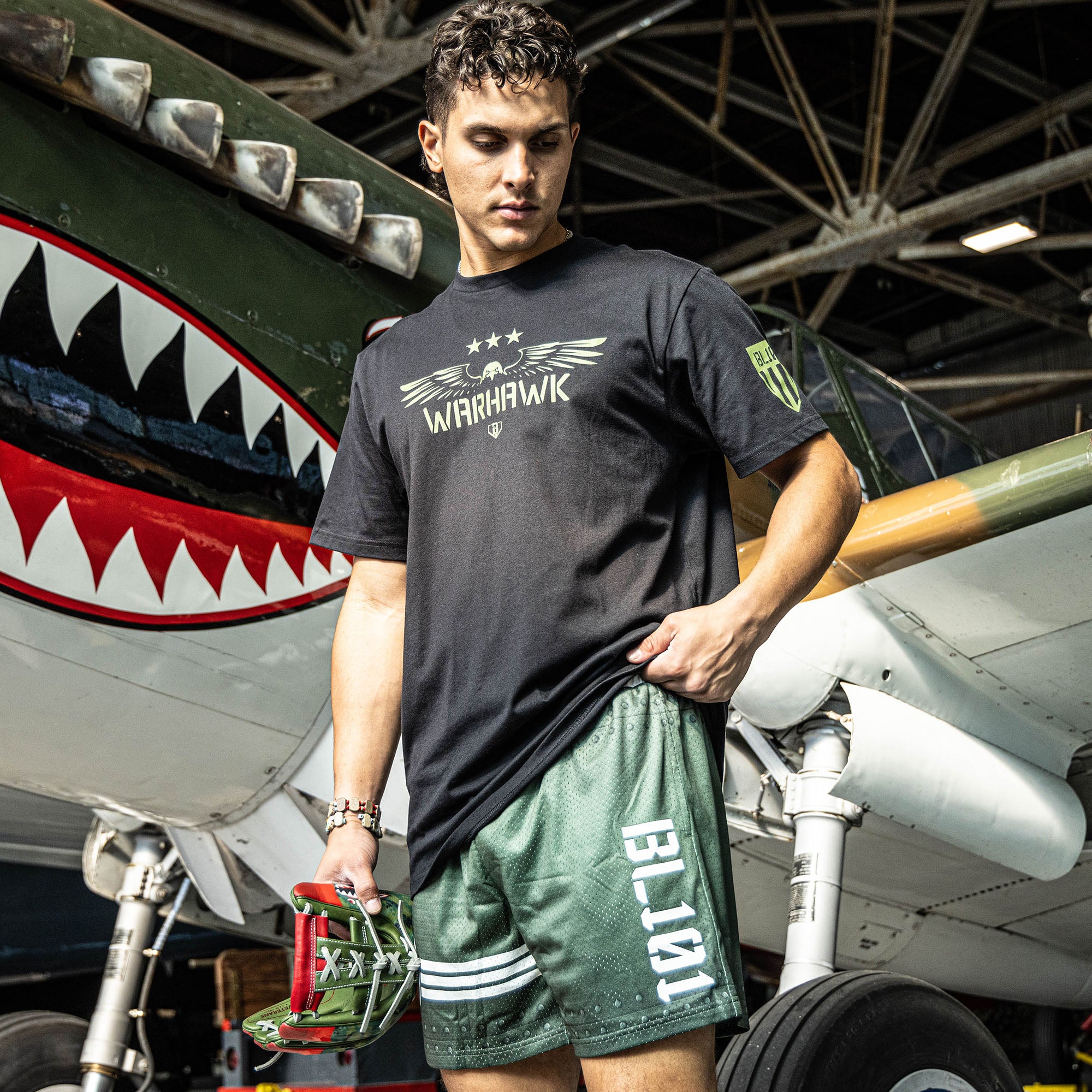Green athletic shorts with white waistband, BL101 logo on side, and star logo with stripes on bottom, modeled on a person.