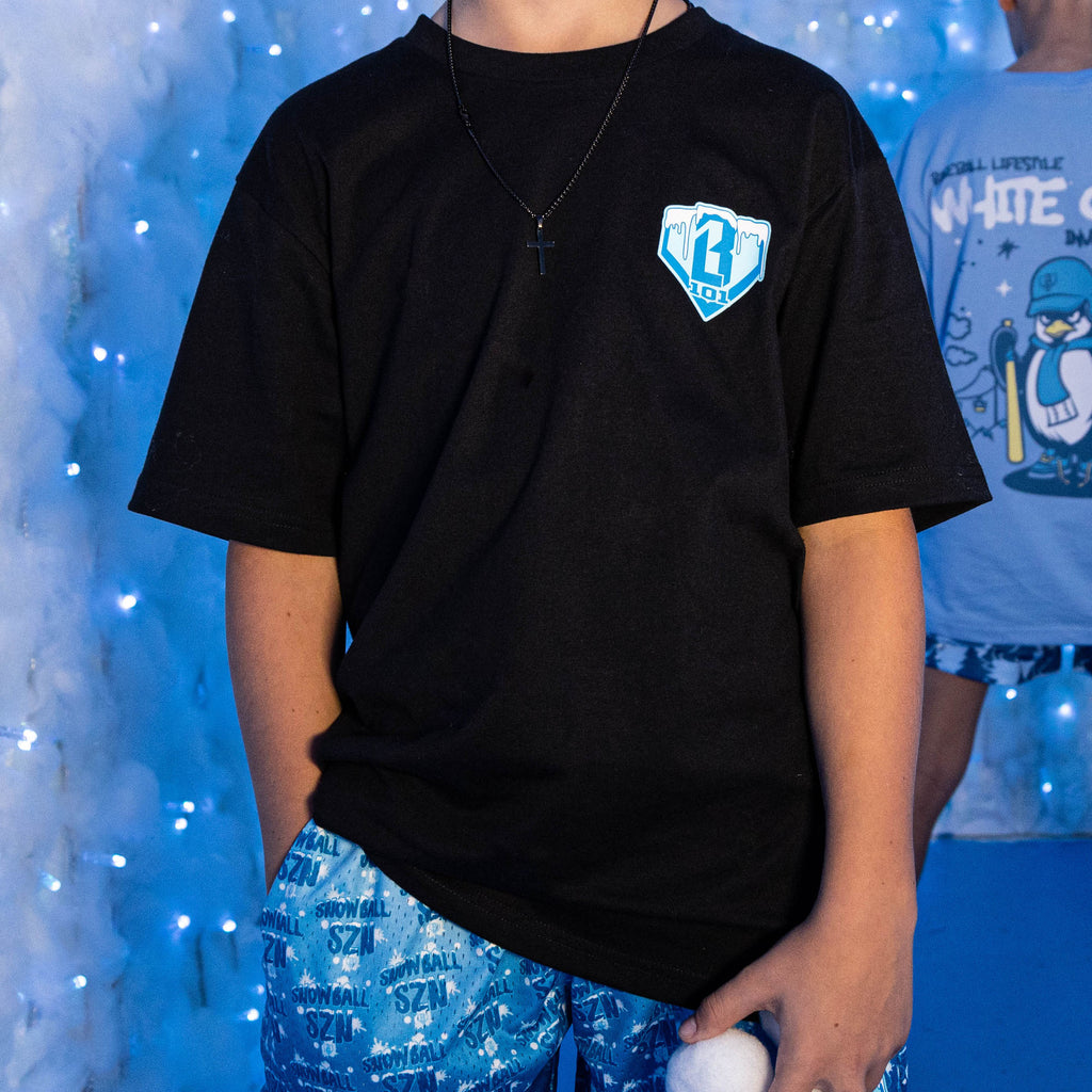 Adult model wearing graphic tee with “Snowball SZN” design