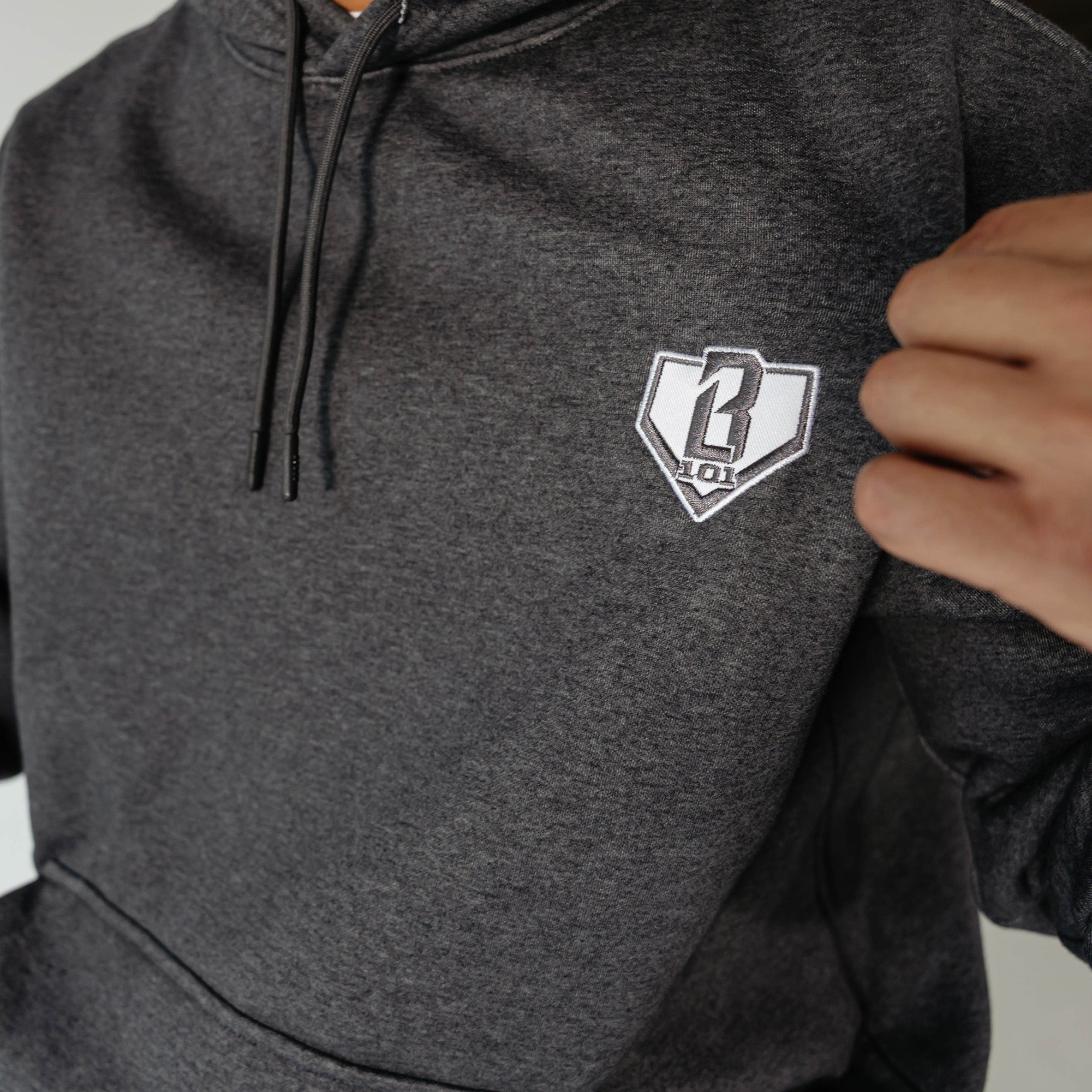 Adult model wearing Gray Baseline hoodie
