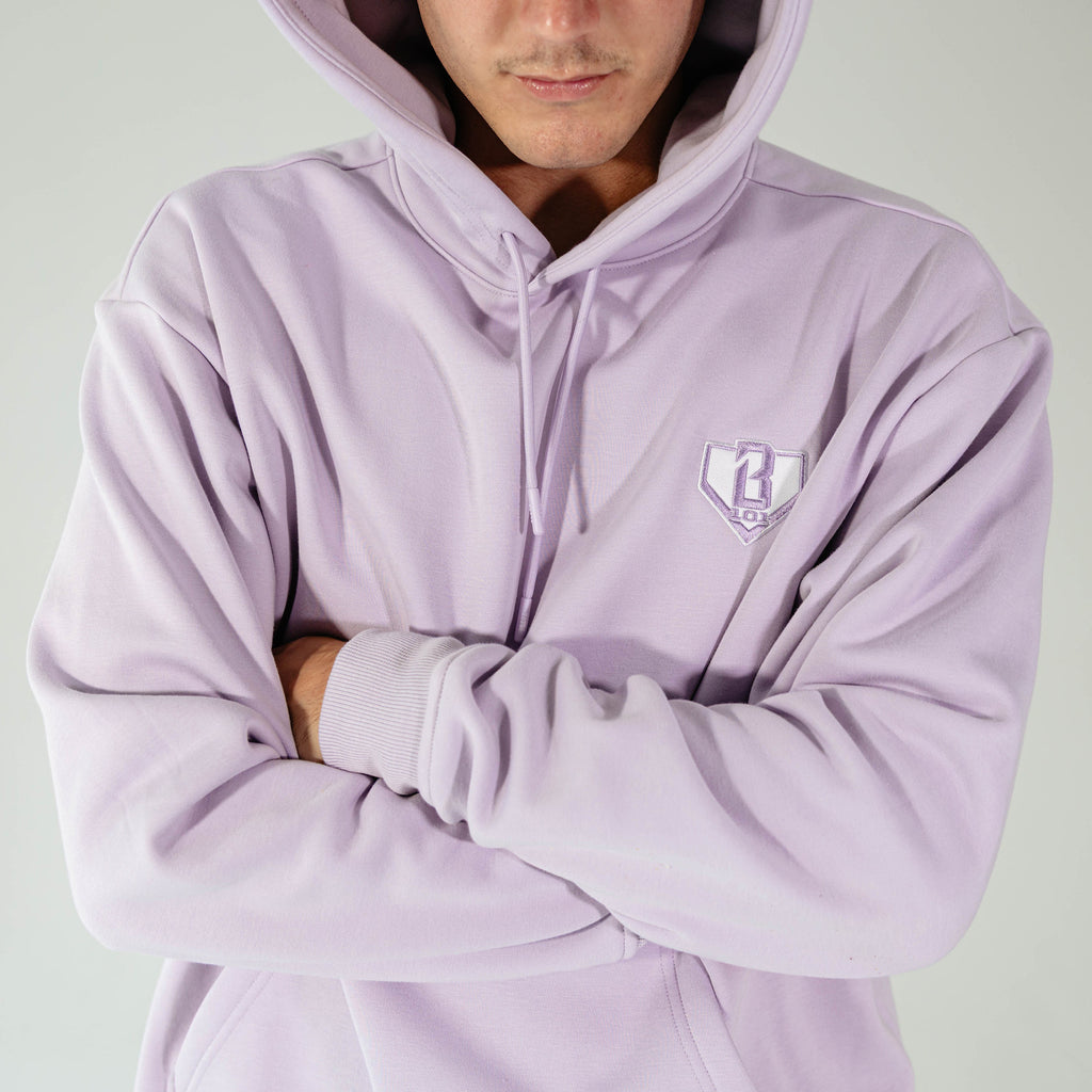 Adult model wearing Purple Baseline hoodie