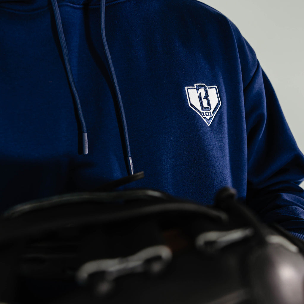 Adult model wearing Navy Baseline hoodie