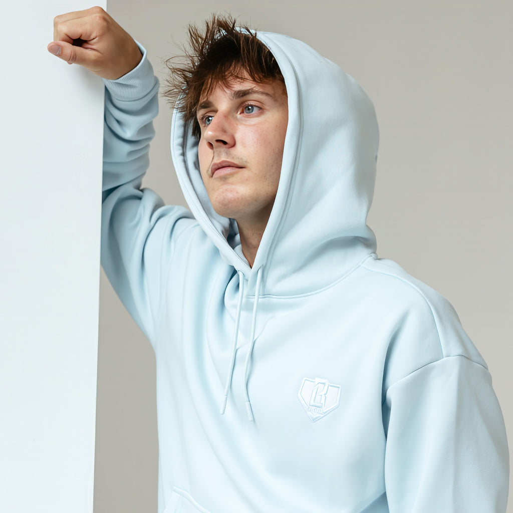 Adult model wearing Blue Baseline hoodie