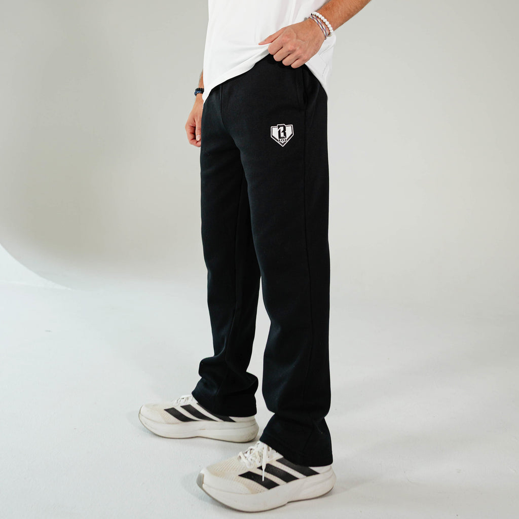 Adult model wearing Black Baseline Straight Leg sweatpants