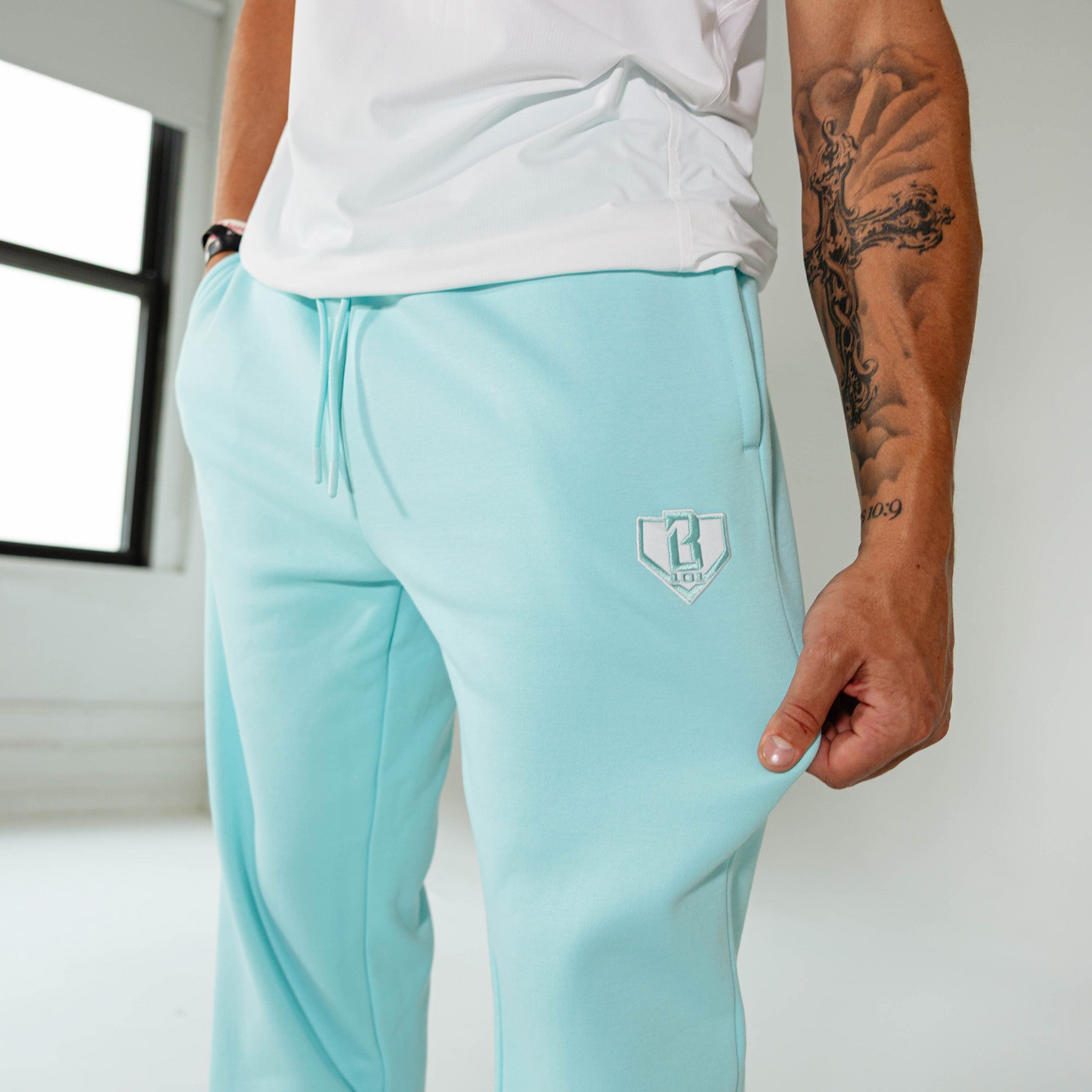 Adult model wearing Blue Baseline Straight Leg sweatpants