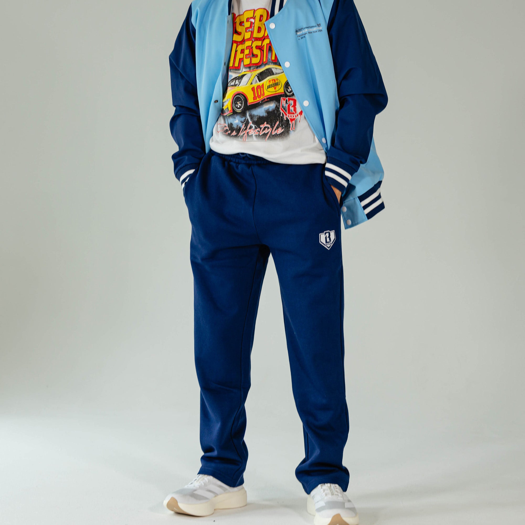 Adult model wearing Navy Baseline Straight Leg sweatpants